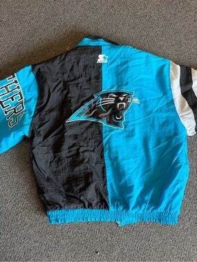 STARTER Carolina Panthers Half-Black Half-Teal Puff Jacket